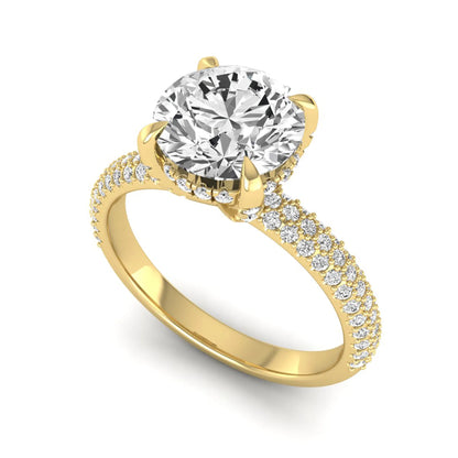 IGI Certified 2.04 carat round cut lab grown diamond hidden halo engagement ring with pavé diamond side stones in yellow gold.