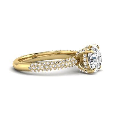 IGI Certified 2.04 carat round cut lab grown diamond hidden halo engagement ring with pavé diamond side stones in yellow gold.