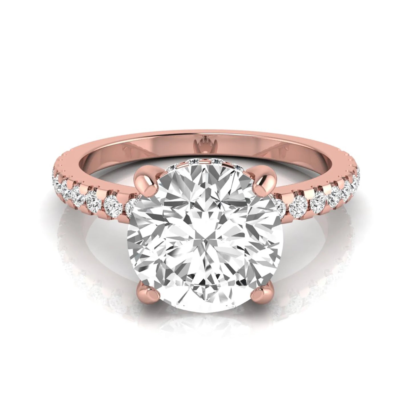 Round cut lab grown diamond engagement ring featuring a hidden halo, pavé accent side diamonds, and a four-prong setting in a rose gold tone with an IGI certified 1.28 carat center diamond.