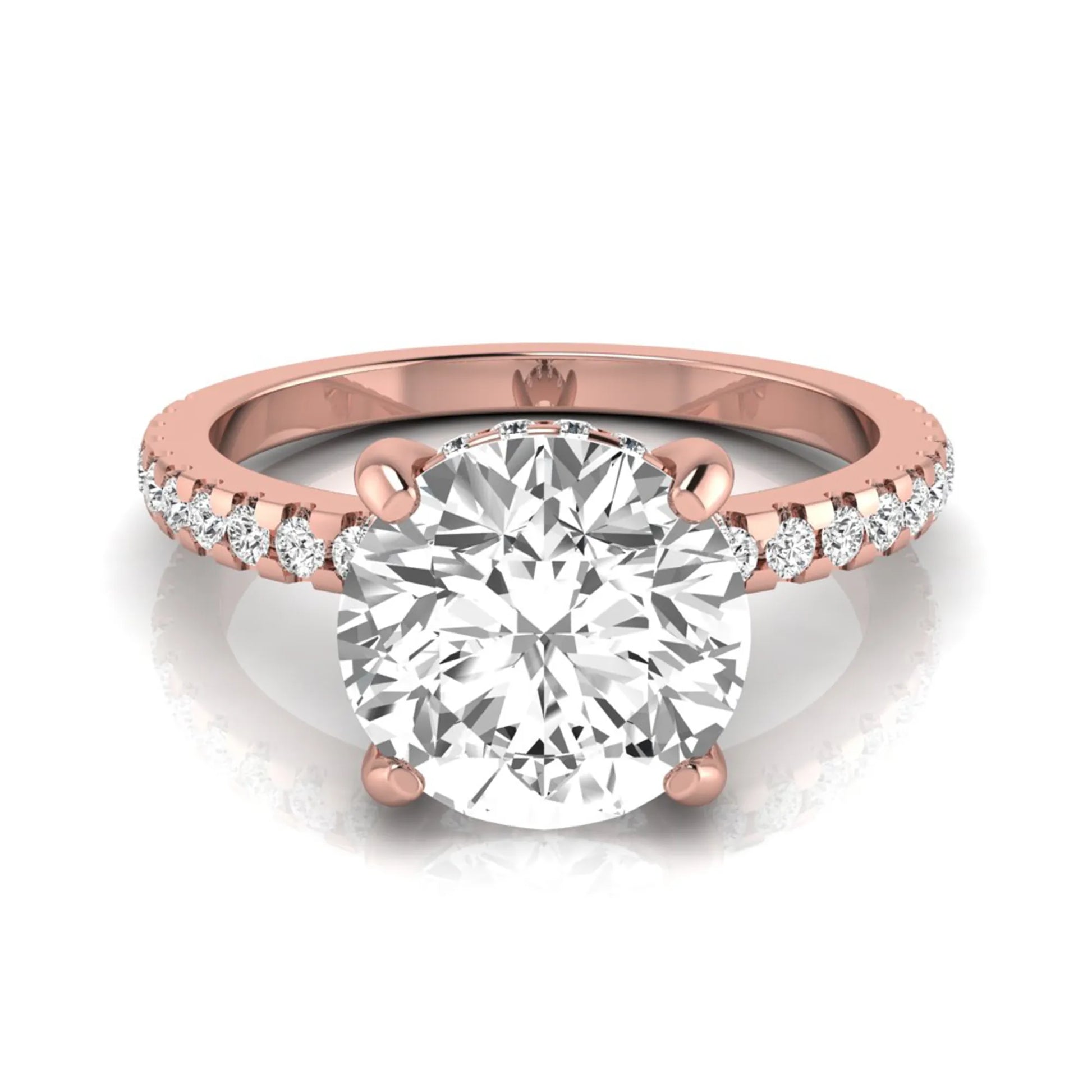 Round cut lab grown diamond engagement ring featuring a hidden halo, pavé accent side diamonds, and a four-prong setting in a rose gold tone with an IGI certified 1.28 carat center diamond.