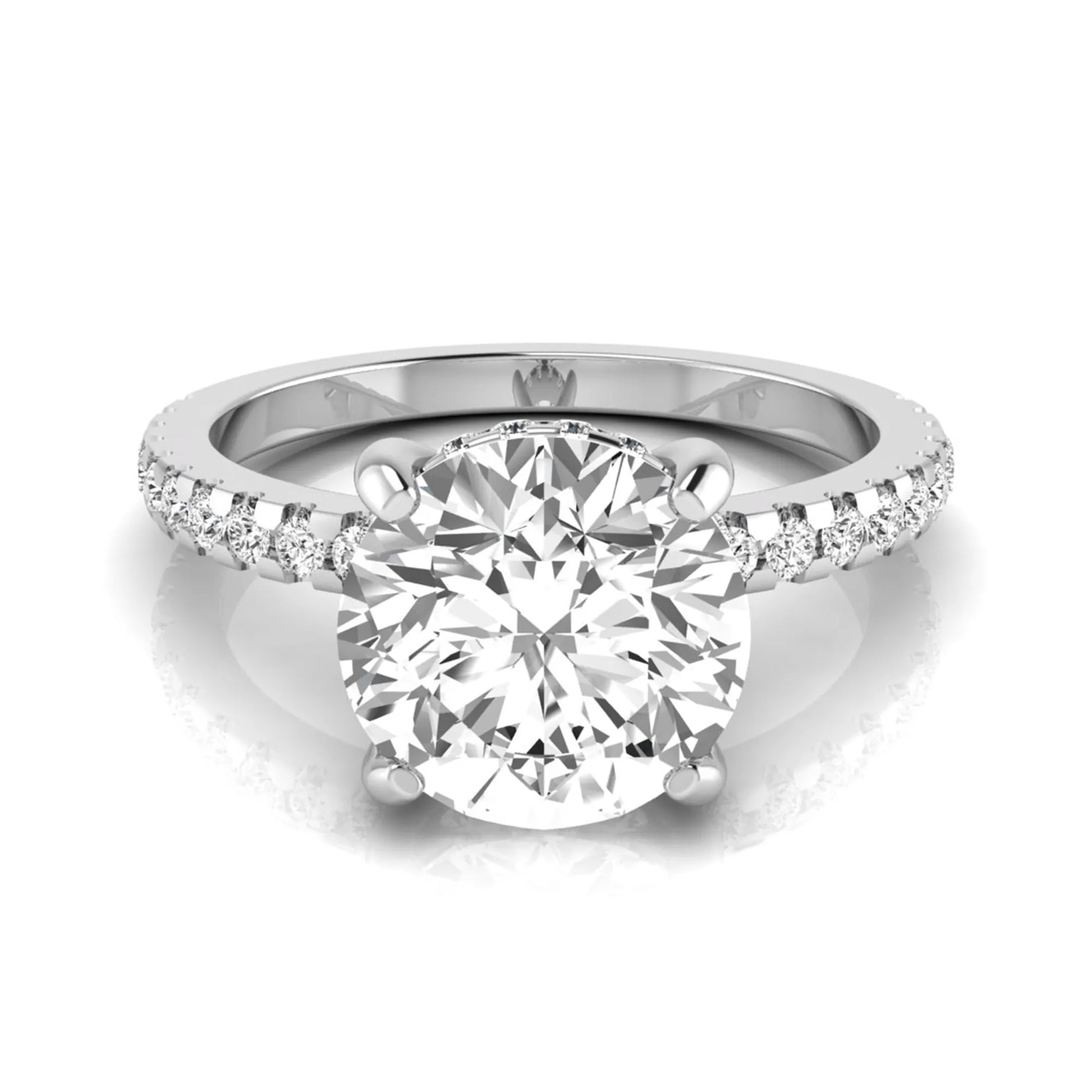 Round cut lab grown diamond engagement ring featuring a hidden halo, pavé accent side diamonds, and a four-prong setting in a white gold tone with an IGI certified 1.28 carat center diamond.