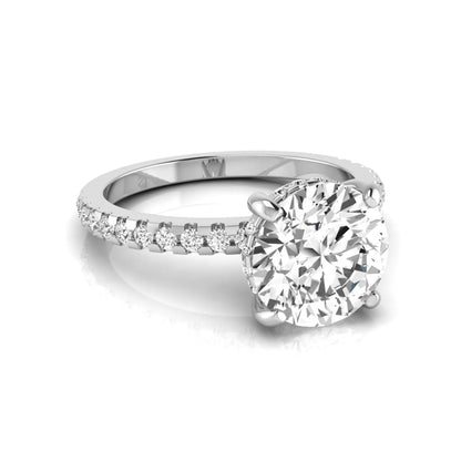 Round cut lab grown diamond engagement ring featuring a hidden halo, pavé accent side diamonds, and a four-prong setting in a white gold tone with an IGI certified 1.28 carat center diamond.