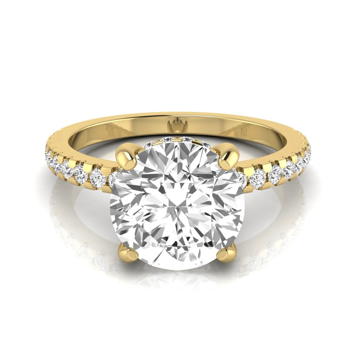 Round cut lab grown diamond engagement ring featuring a hidden halo, pavé accent side diamonds, and a four-prong setting in a yellow gold tone with an IGI certified 1.28 carat center diamond.