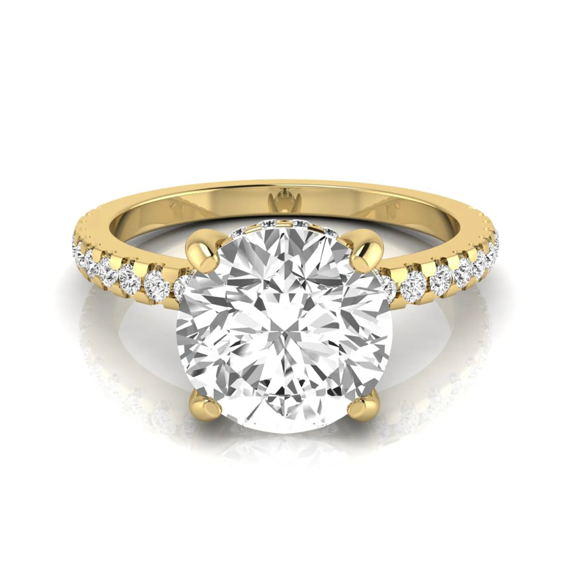 Round cut lab grown diamond engagement ring featuring a hidden halo, pavé accent side diamonds, and a four-prong setting in a yellow gold tone with an IGI certified 1.28 carat center diamond.