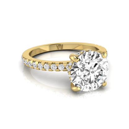 Round cut lab grown diamond engagement ring featuring a hidden halo, pavé accent side diamonds, and a four-prong setting in a yellow gold tone with an IGI certified 1.28 carat center diamond.