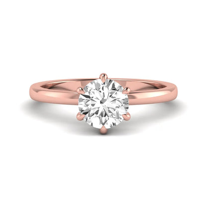 Round cut lab grown diamond solitaire engagement ring with hidden halo and six-prong setting in a rose gold tone design.