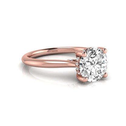 Round hidden halo lab grown diamond solitaire engagement ring featuring a 2.04 carat IGI certified round diamond in a four-prong setting with a polished rose gold band.