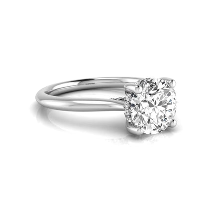 Round hidden halo lab grown diamond solitaire engagement ring featuring a 2.04 carat IGI certified round diamond in a four-prong setting with a polished white gold band.