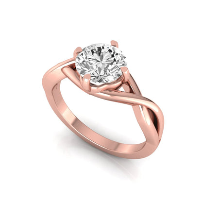 Round cut lab grown diamond engagement ring featuring a four-prong solitaire setting with an infinity-inspired crossover shank and polished rose gold tone band.