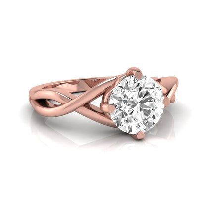 Round cut lab grown diamond engagement ring featuring a four-prong solitaire setting with an infinity-inspired crossover shank and polished rose gold tone band.