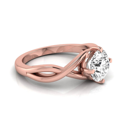 Round cut lab grown diamond engagement ring featuring a four-prong solitaire setting with an infinity-inspired crossover shank and polished rose gold tone band.