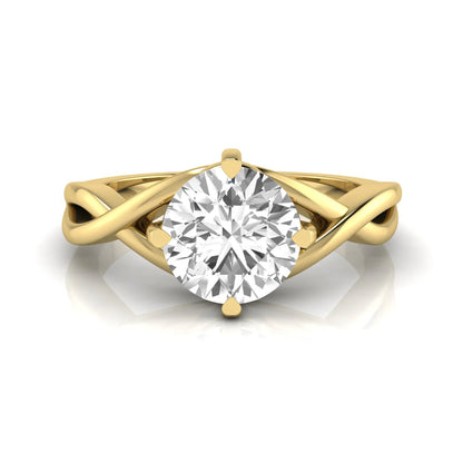 Round cut lab grown diamond engagement ring featuring a four-prong solitaire setting with an infinity-inspired crossover shank and polished yellow gold tone band.