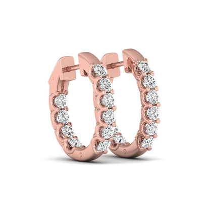 Round cut lab grown diamond inside-out hoop earrings featuring shared prong settings, hinged snap closure, and rose gold tone design.