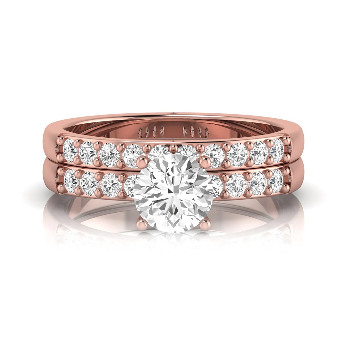 Round cut lab grown diamond bridal ring set featuring a 1.03 carat IGI certified solitaire engagement ring with a double pavé diamond band and matching diamond wedding band in polished rose gold.