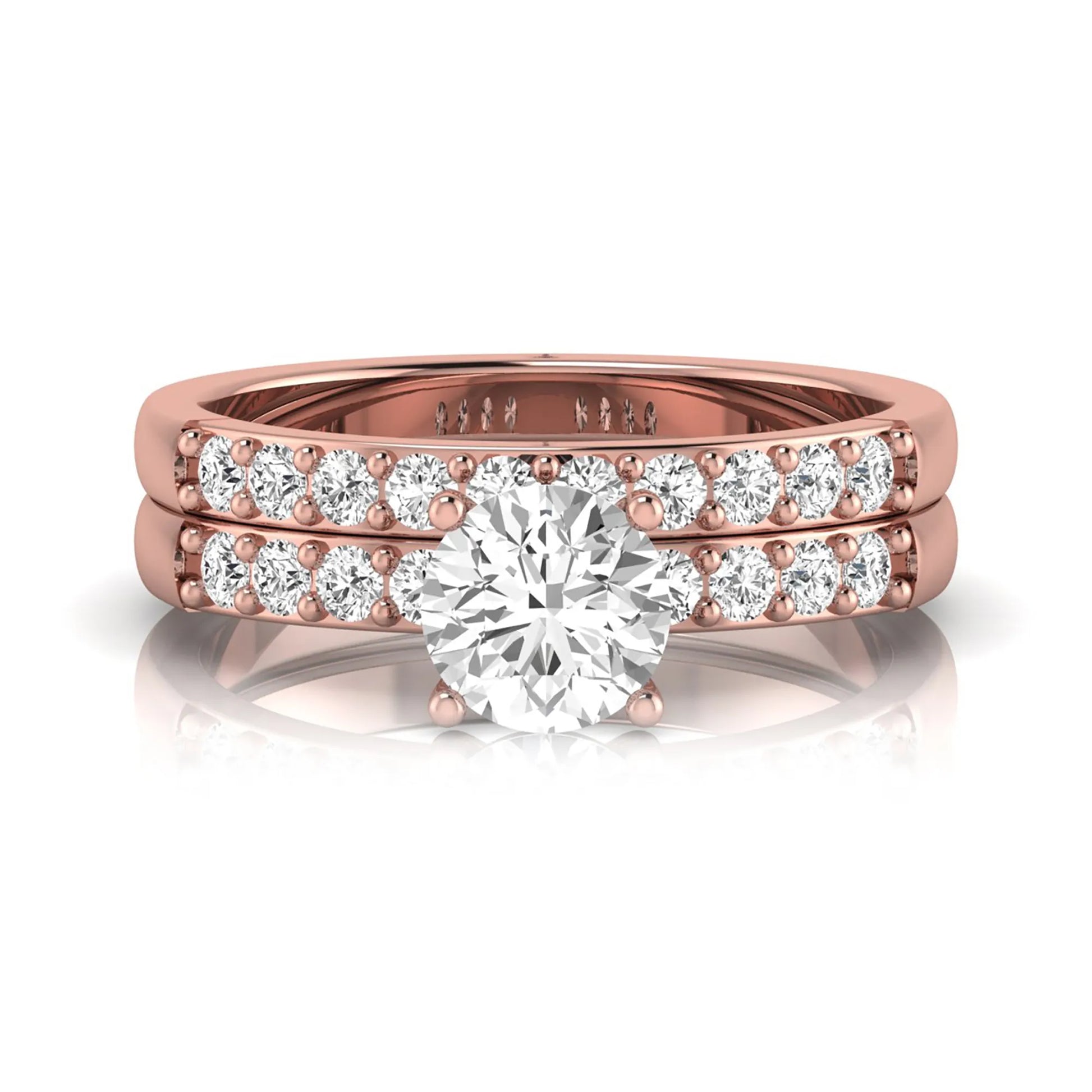 Round cut lab grown diamond bridal ring set featuring a 1.03 carat IGI certified solitaire engagement ring with a double pavé diamond band and matching diamond wedding band in polished rose gold.