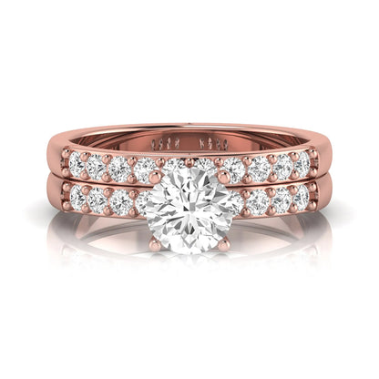 Round cut lab grown diamond bridal ring set featuring a 1.03 carat IGI certified solitaire engagement ring with a double pavé diamond band and matching diamond wedding band in polished rose gold.