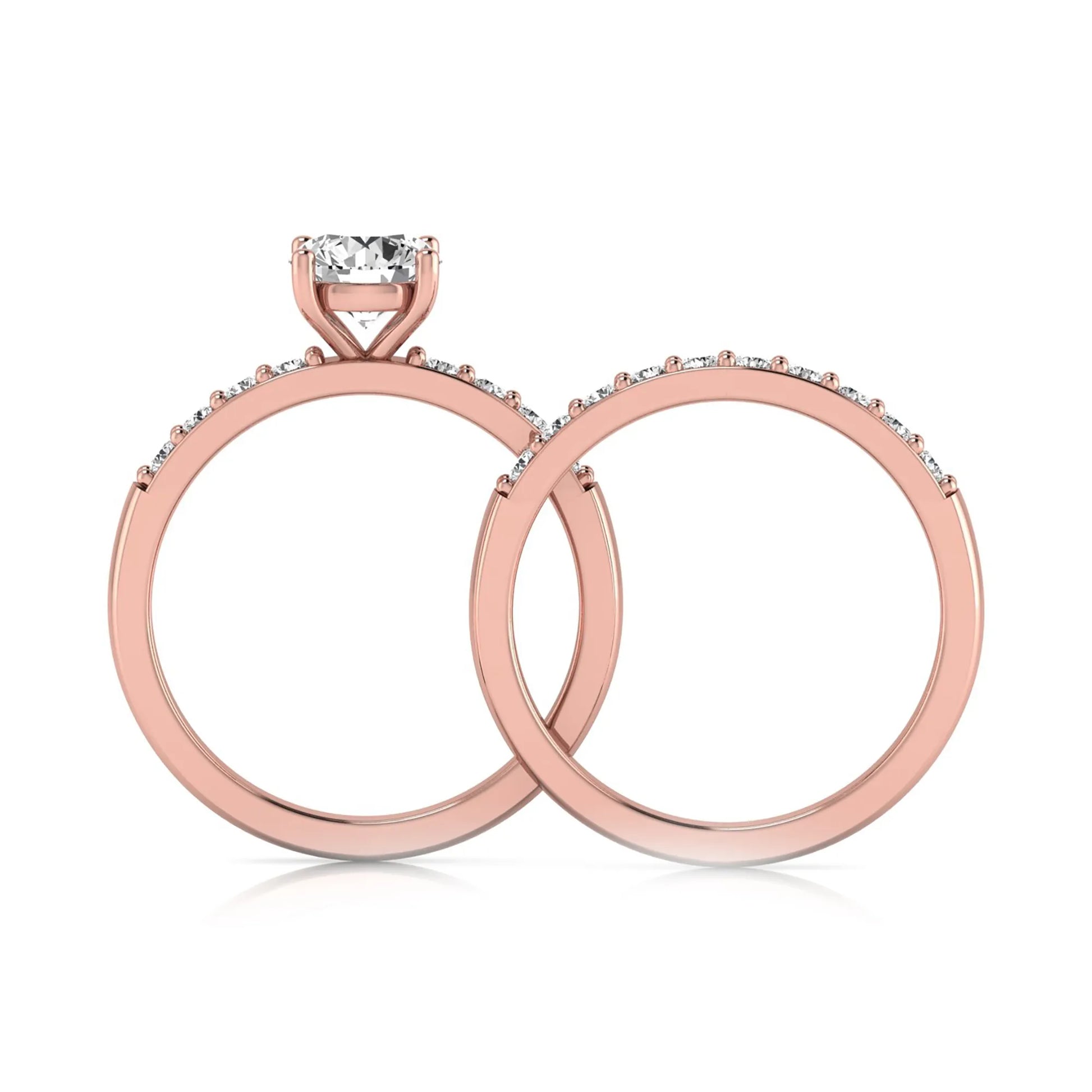 Round cut lab grown diamond bridal ring set featuring a 1.03 carat IGI certified solitaire engagement ring with a double pavé diamond band and matching diamond wedding band in polished rose gold.