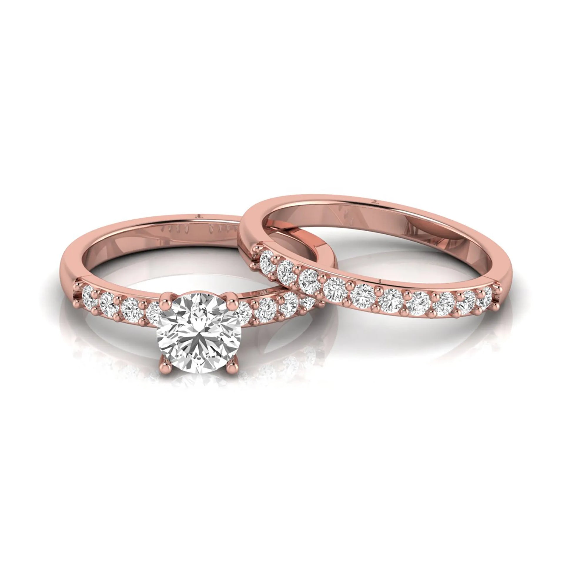 Round cut lab grown diamond bridal ring set featuring a 1.03 carat IGI certified solitaire engagement ring with a double pavé diamond band and matching diamond wedding band in polished rose gold.