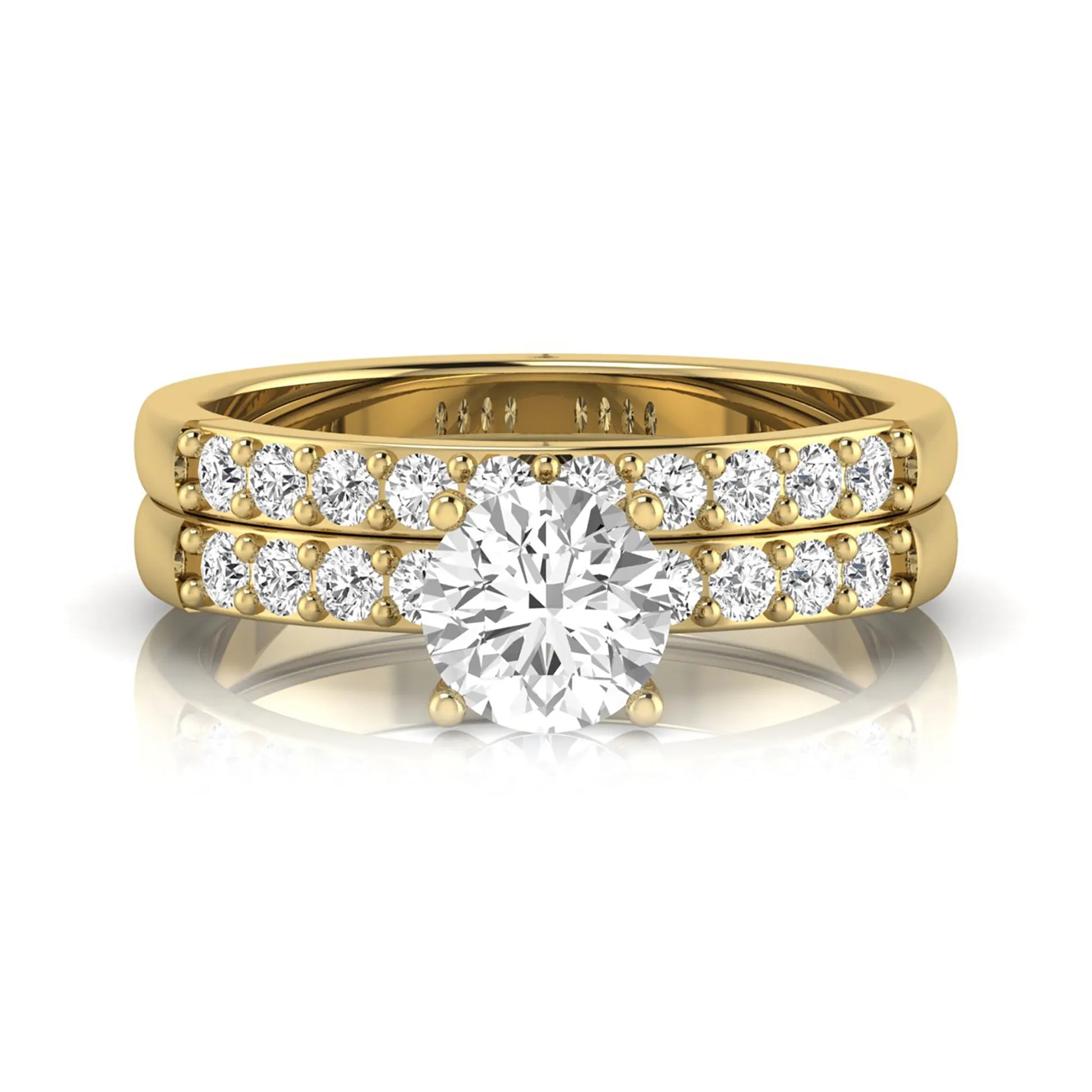 Round cut lab grown diamond bridal ring set featuring a 1.03 carat IGI certified solitaire engagement ring with a double pavé diamond band and matching diamond wedding band in polished yellow gold.