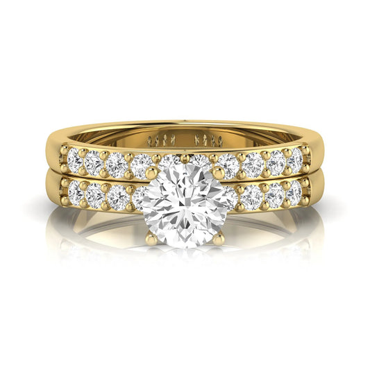 Round cut lab grown diamond bridal ring set featuring a 1.03 carat IGI certified solitaire engagement ring with a double pavé diamond band and matching diamond wedding band in polished yellow gold.