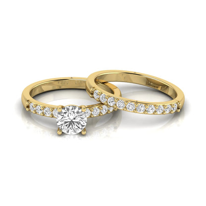 Round cut lab grown diamond bridal ring set featuring a 1.03 carat IGI certified solitaire engagement ring with a double pavé diamond band and matching diamond wedding band in polished yellow gold.