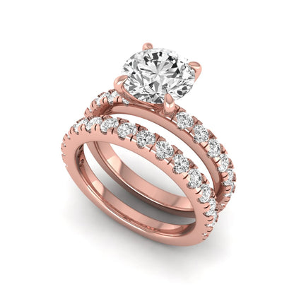 Round cut lab grown diamond bridal ring set in rose gold featuring a 1.67 carat IGI certified center diamond with matching diamond wedding band.