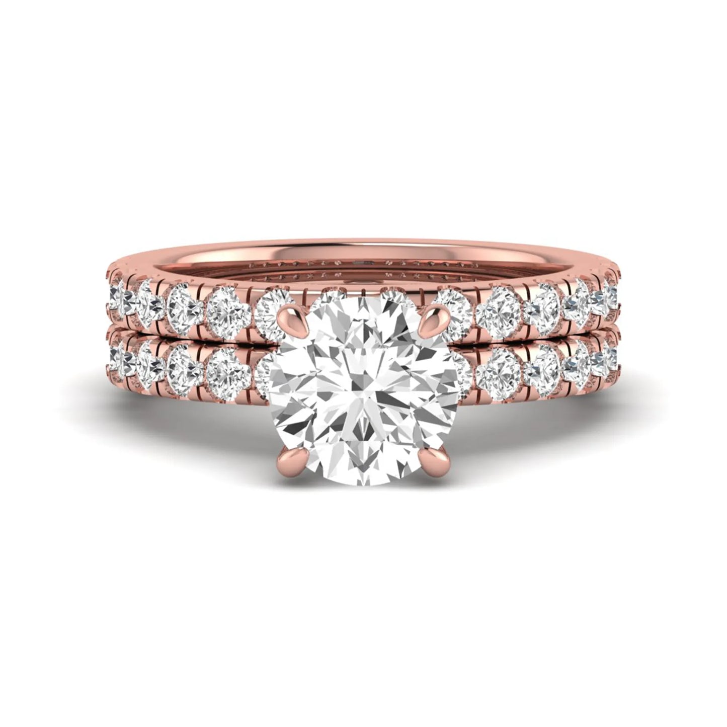 Round cut lab grown diamond bridal ring set in rose gold featuring a 1.67 carat IGI certified center diamond with matching diamond wedding band.
