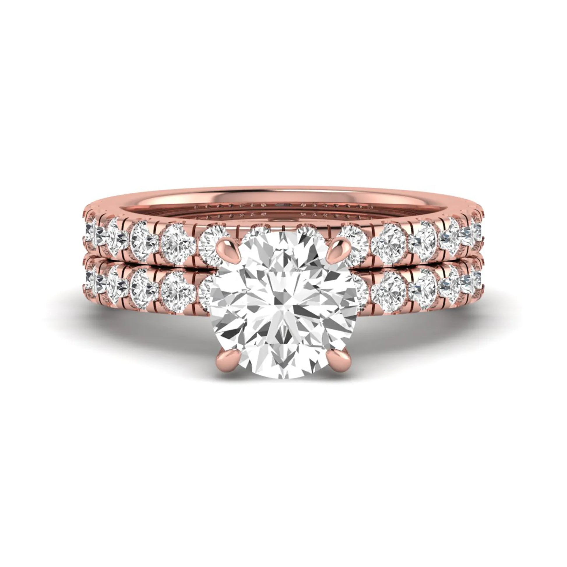 Round cut lab grown diamond bridal ring set in rose gold featuring a 1.67 carat IGI certified center diamond with matching diamond wedding band.