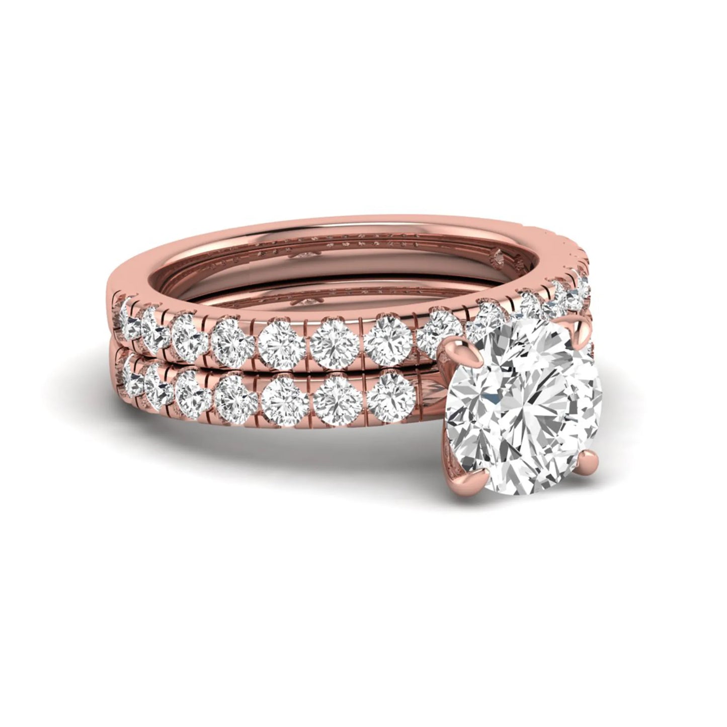 Round cut lab grown diamond bridal ring set in rose gold featuring a 1.67 carat IGI certified center diamond with matching diamond wedding band.