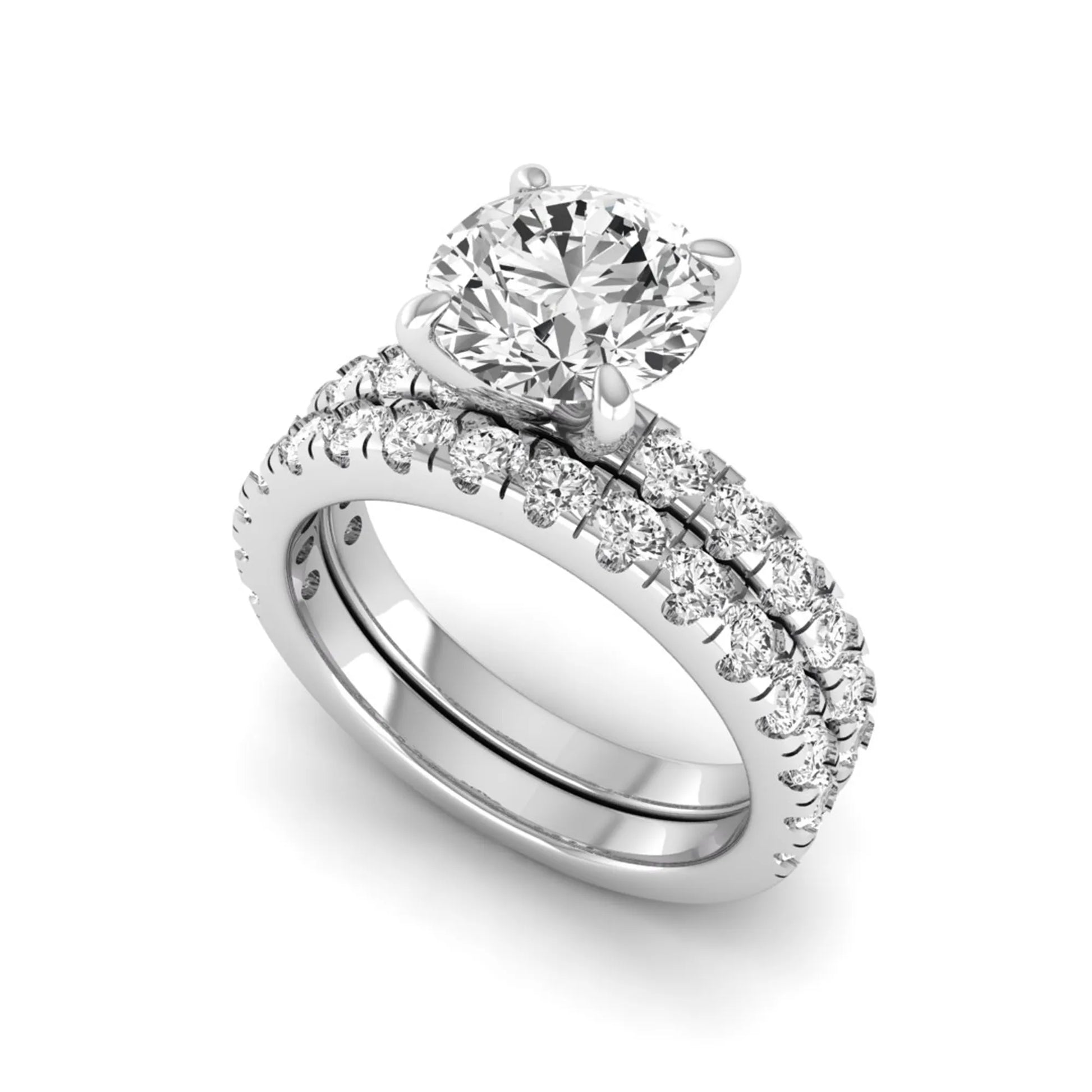 Round cut lab grown diamond bridal ring set in white gold featuring a 1.67 carat IGI certified center diamond with matching diamond wedding band.