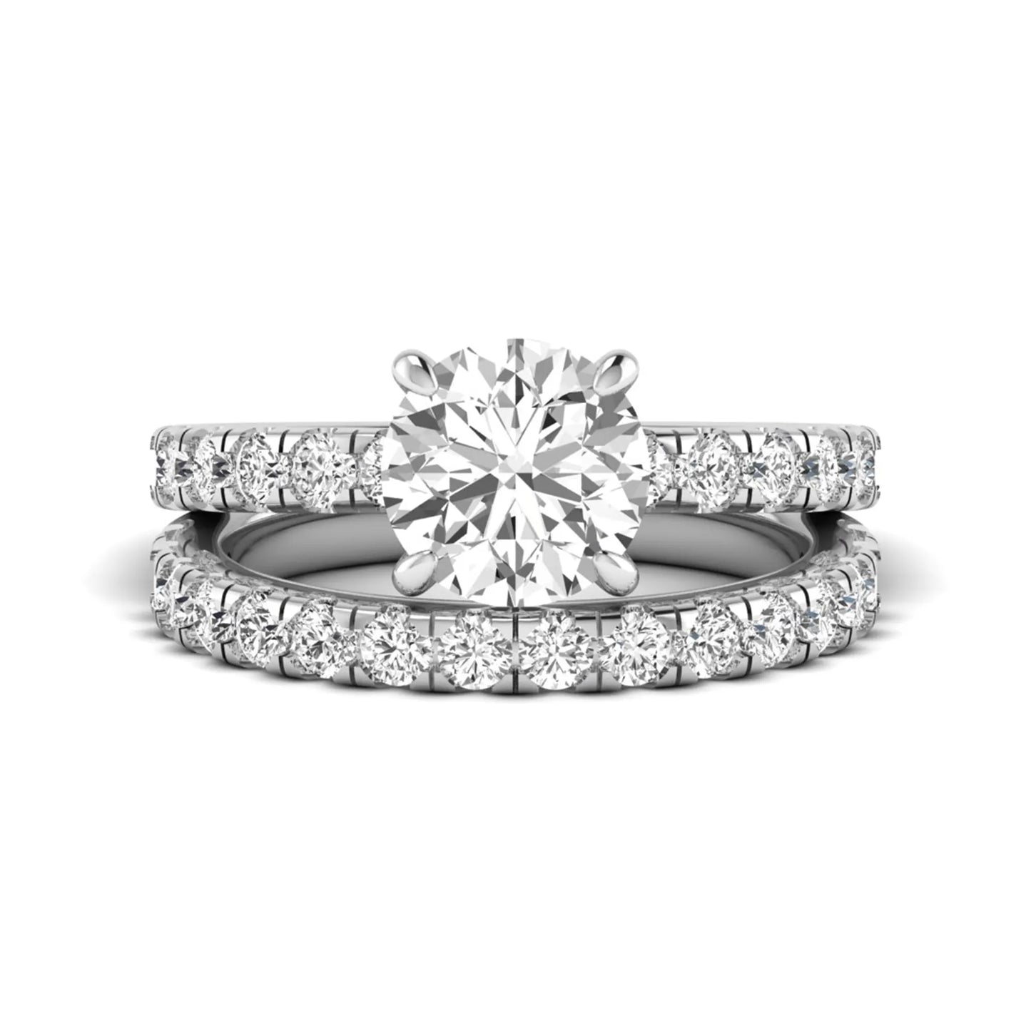 Round cut lab grown diamond bridal ring set in white gold featuring a 1.67 carat IGI certified center diamond with matching diamond wedding band.
