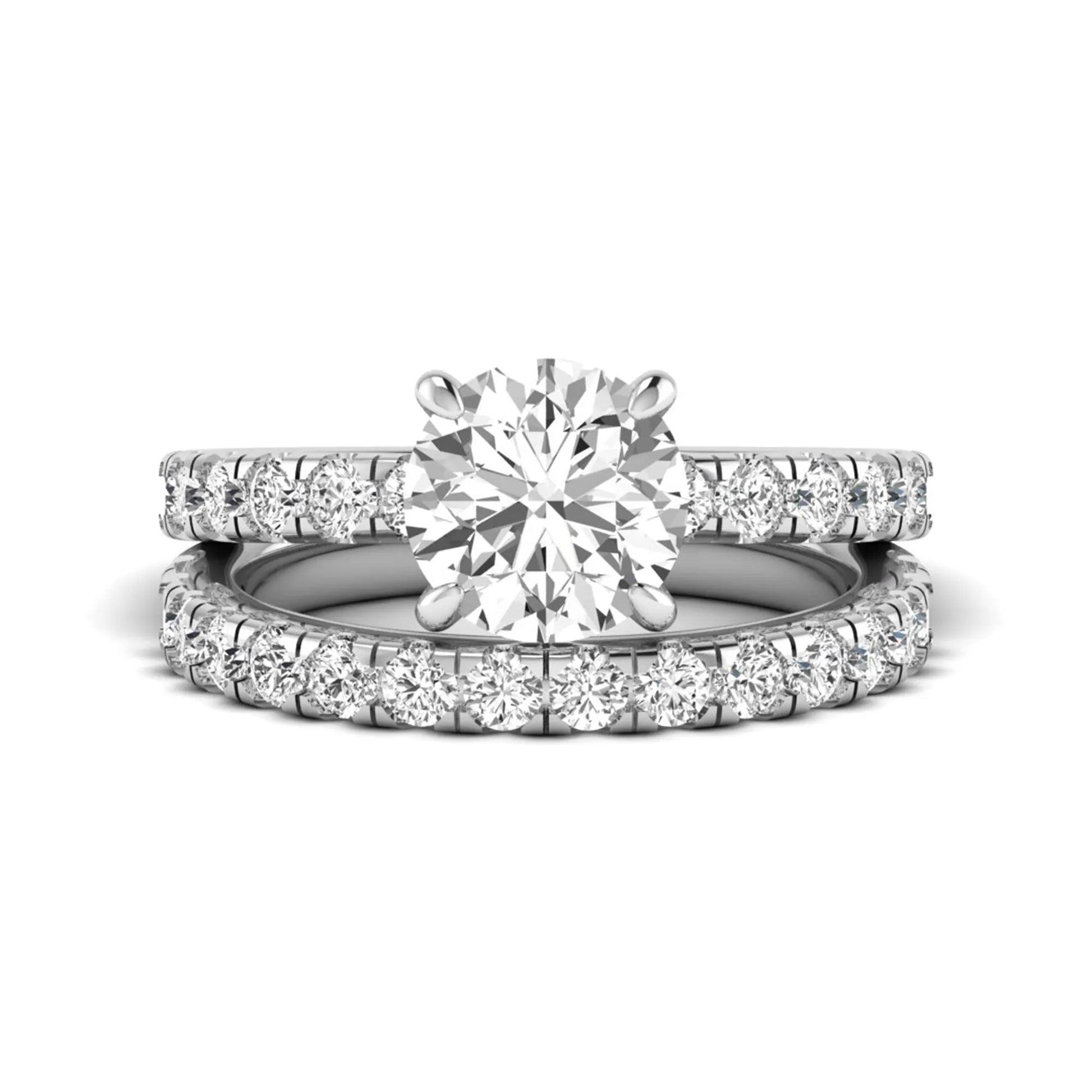 Round cut lab grown diamond bridal ring set in white gold featuring a 1.67 carat IGI certified center diamond with matching diamond wedding band.