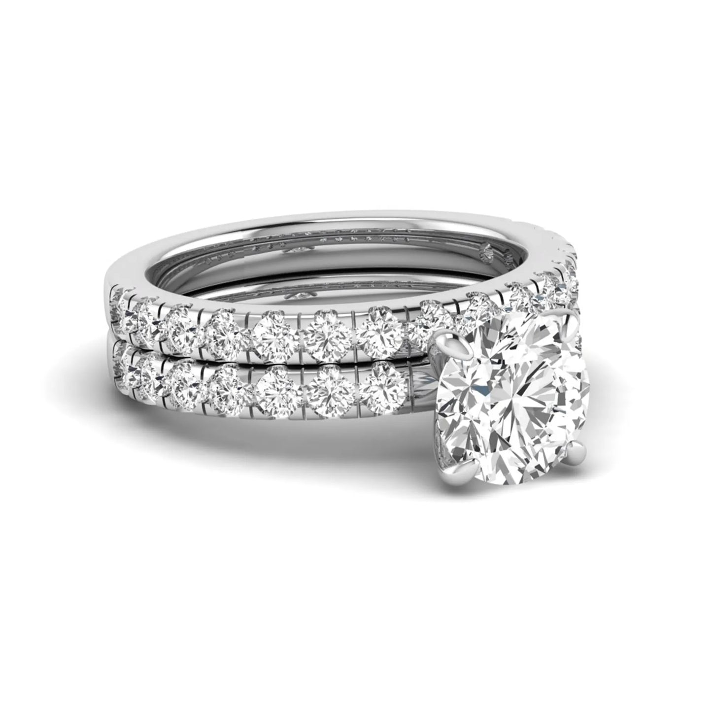Round cut lab grown diamond bridal ring set in white gold featuring a 1.67 carat IGI certified center diamond with matching diamond wedding band.