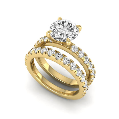 Round cut lab grown diamond bridal ring set in yellow gold featuring a 1.67 carat IGI certified center diamond with matching diamond wedding band.