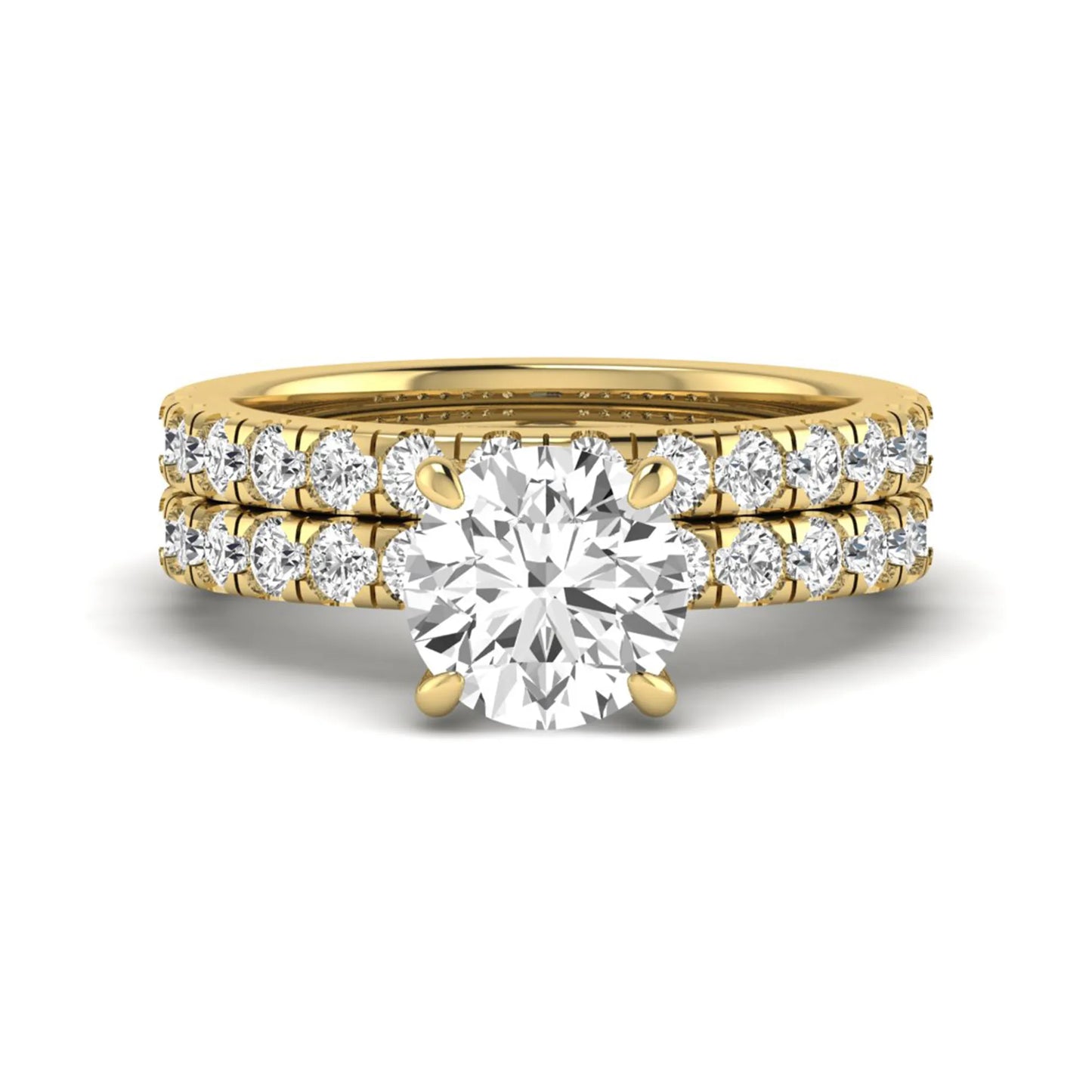 Round cut lab grown diamond bridal ring set in yellow gold featuring a 1.67 carat IGI certified center diamond with matching diamond wedding band.