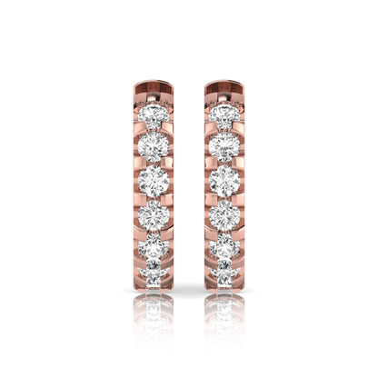 Round lab grown diamond half eternity huggie hoop earrings featuring a continuous row of round brilliant diamonds in a shared prong setting in rose gold
