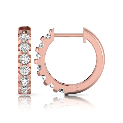 Round lab grown diamond half eternity huggie hoop earrings featuring a continuous row of round brilliant diamonds in a shared prong setting in rose gold