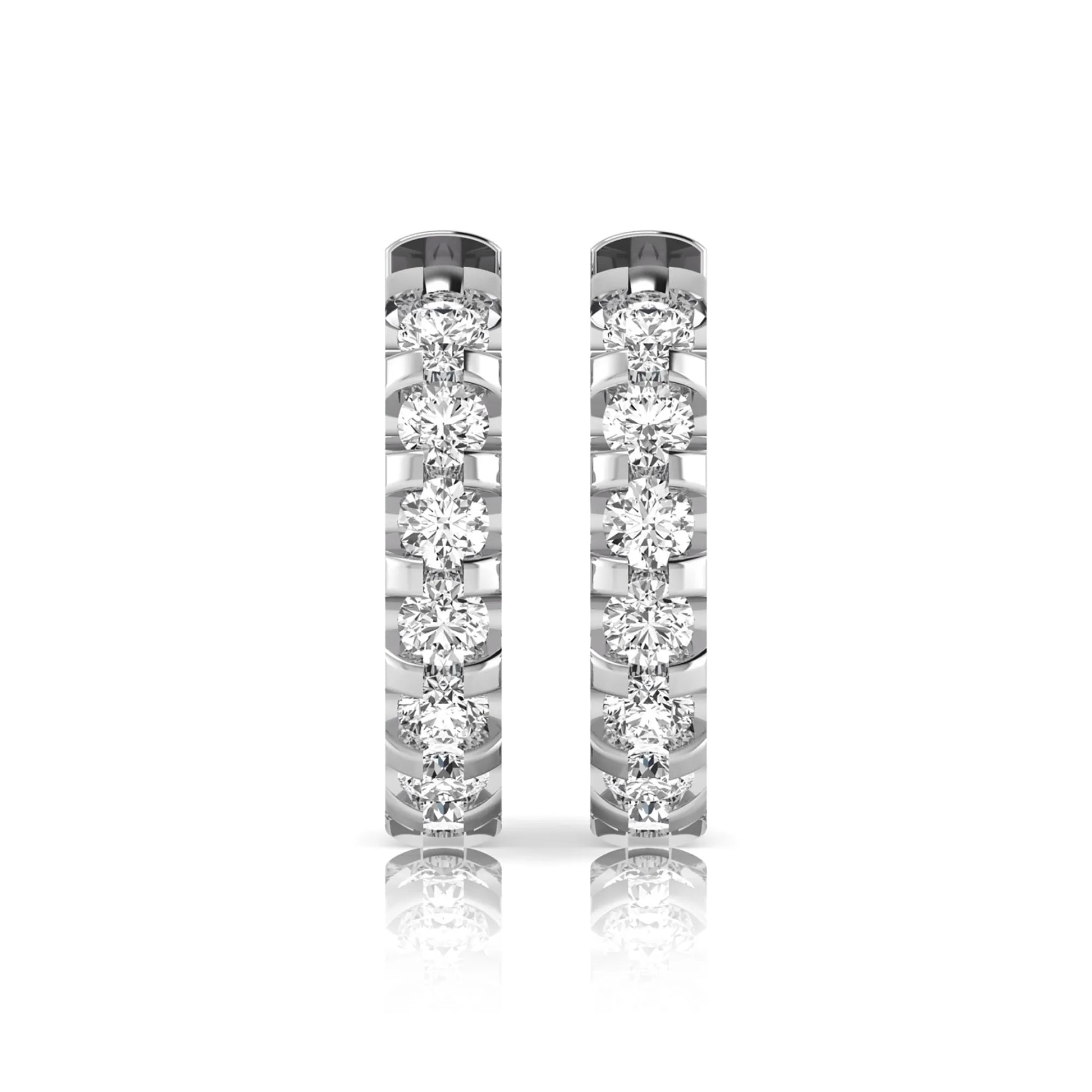 Round lab grown diamond half eternity huggie hoop earrings featuring a continuous row of round brilliant diamonds in a shared prong setting in white gold