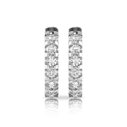 Round lab grown diamond half eternity huggie hoop earrings featuring a continuous row of round brilliant diamonds in a shared prong setting in white gold