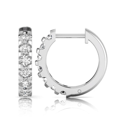 Round lab grown diamond half eternity huggie hoop earrings featuring a continuous row of round brilliant diamonds in a shared prong setting in white gold