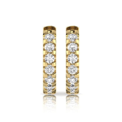 Round lab grown diamond half eternity huggie hoop earrings featuring a continuous row of round brilliant diamonds in a shared prong setting in yellow gold