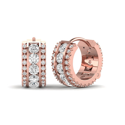Round cut lab grown diamond multi-row huggie hoop earrings featuring a center row of diamonds with side accent diamonds and a hinged snap closure in a rose gold tone.