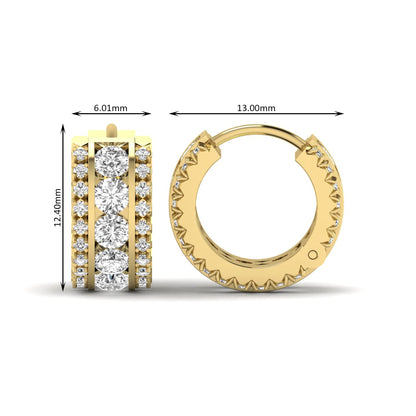 Round cut lab grown diamond multi-row huggie hoop earrings featuring a center row of diamonds with side accent diamonds and a hinged snap closure in a yellow gold tone.