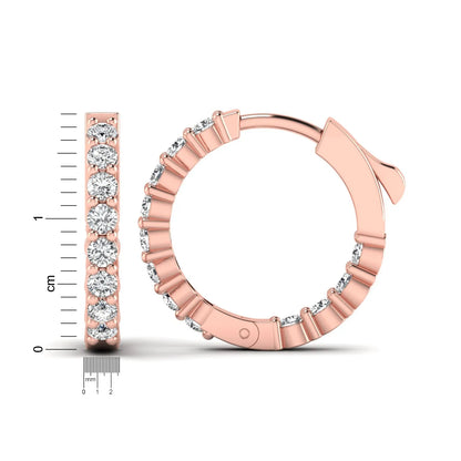 rose gold Round cut lab grown diamond huggie hoop earrings with prong setting and hinged hoop closure