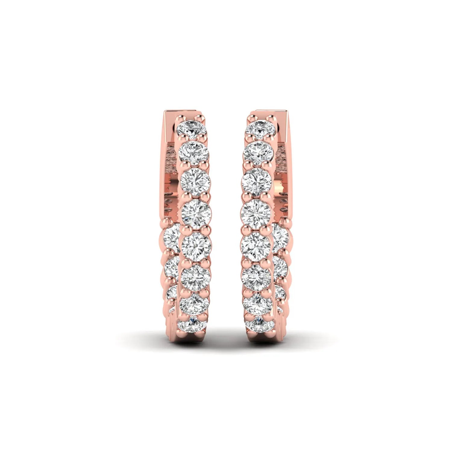 rose gold Round cut lab grown diamond huggie hoop earrings with prong setting and hinged hoop closure