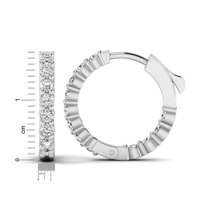 white gold Round cut lab grown diamond huggie hoop earrings with prong setting and hinged hoop closure