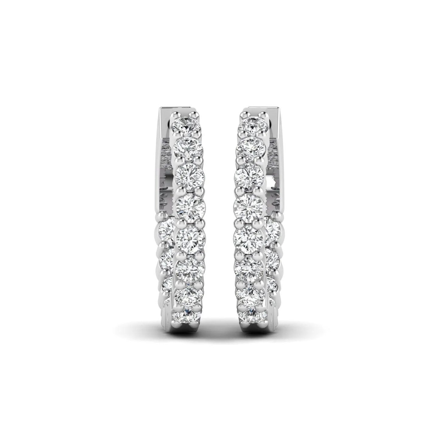 white gold Round cut lab grown diamond huggie hoop earrings with prong setting and hinged hoop closure