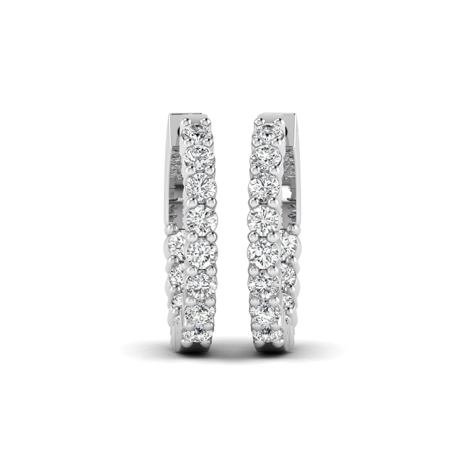 white gold Round cut lab grown diamond huggie hoop earrings with prong setting and hinged hoop closure