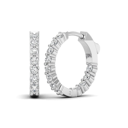white gold Round cut lab grown diamond huggie hoop earrings with prong setting and hinged hoop closure