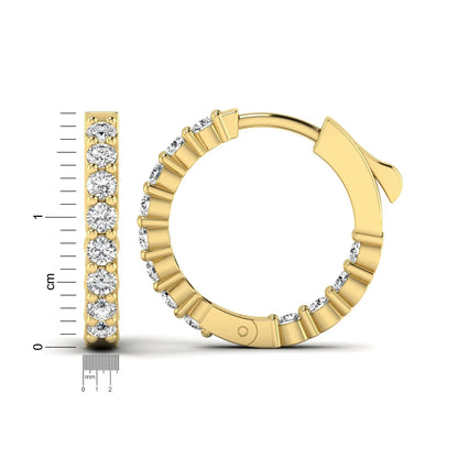 yellow gold Round cut lab grown diamond huggie hoop earrings with prong setting and hinged hoop closure